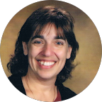 smiling woman with medium length shaggy hair
